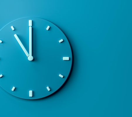 Blue clock on blue wall