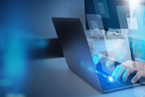 person on laptop with process icons hovering above