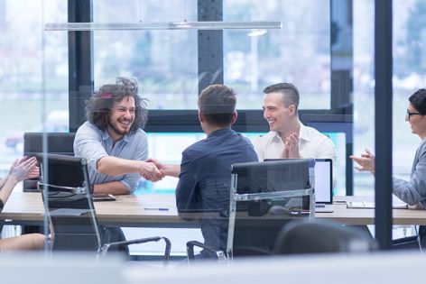 Business people sitting around a table talking